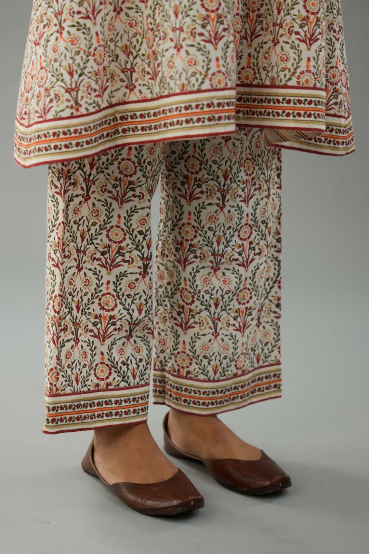 Red & green cotton A-line short kurta with all over multi colored jaal hand block print.