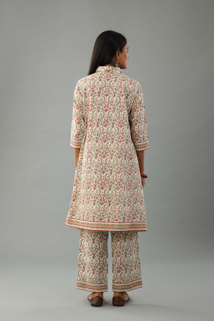 Red & green cotton A-line short kurta with all over multi colored jaal hand block print.