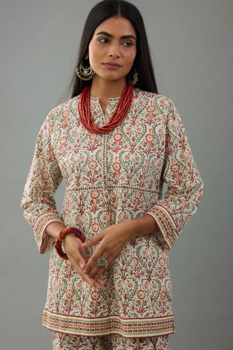 Red & green cotton short top with all-over hand block print, paired with blue and pink hand block printed cotton straight pants.