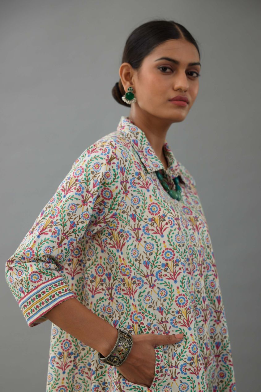 Blue & pink cotton A-line short kurta with all over multi colored jaal hand block print.