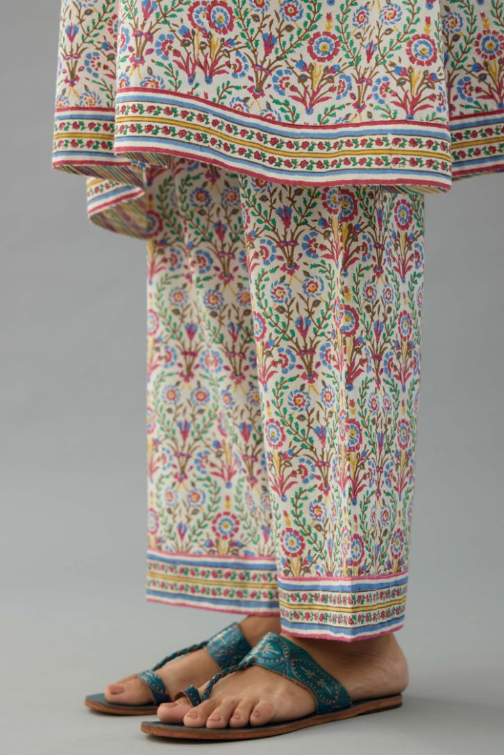 Blue & pink cotton A-line short kurta with all over multi colored jaal hand block print.