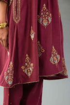 Wine Silk Chanderi short kurta set with collar and front placket, detailed with delicate gold embroidery is done around the placket and collar.
