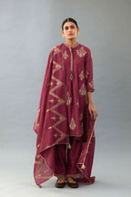 Wine Silk Chanderi short kurta set with collar and front placket, detailed with delicate gold embroidery is done around the placket and collar.