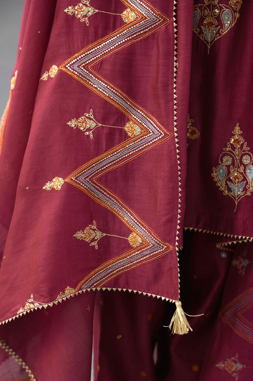 Wine Silk Chanderi short kurta set with collar and front placket, detailed with delicate gold embroidery is done around the placket and collar.