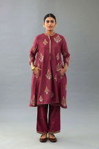 Wine Silk Chanderi short kurta set with collar and front placket, detailed with delicate gold embroidery is done around the placket and collar.