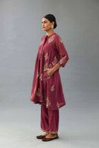 Wine Silk Chanderi short kurta set with collar and front placket, detailed with delicate gold embroidery is done around the placket and collar.