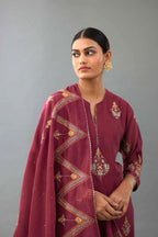 Wine silk chanderi straight kurta set with zari, dori and contrast silk thread embroidered bootas, highlighted with gold sequins work.