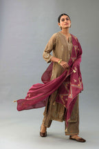 Taupe silk chanderi straight kurta set with all-over zari, dori and contrast silk thread embroidery, highlighted with gold sequins work.