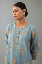 Light blue silk chanderi A-line short kurta set with dori and contrast silk thread embroidery, highlighted with gold sequins work.