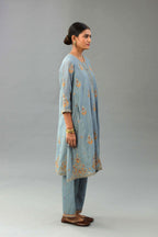 Light blue silk chanderi A-line short kurta set with dori and contrast silk thread embroidery, highlighted with gold sequins work.