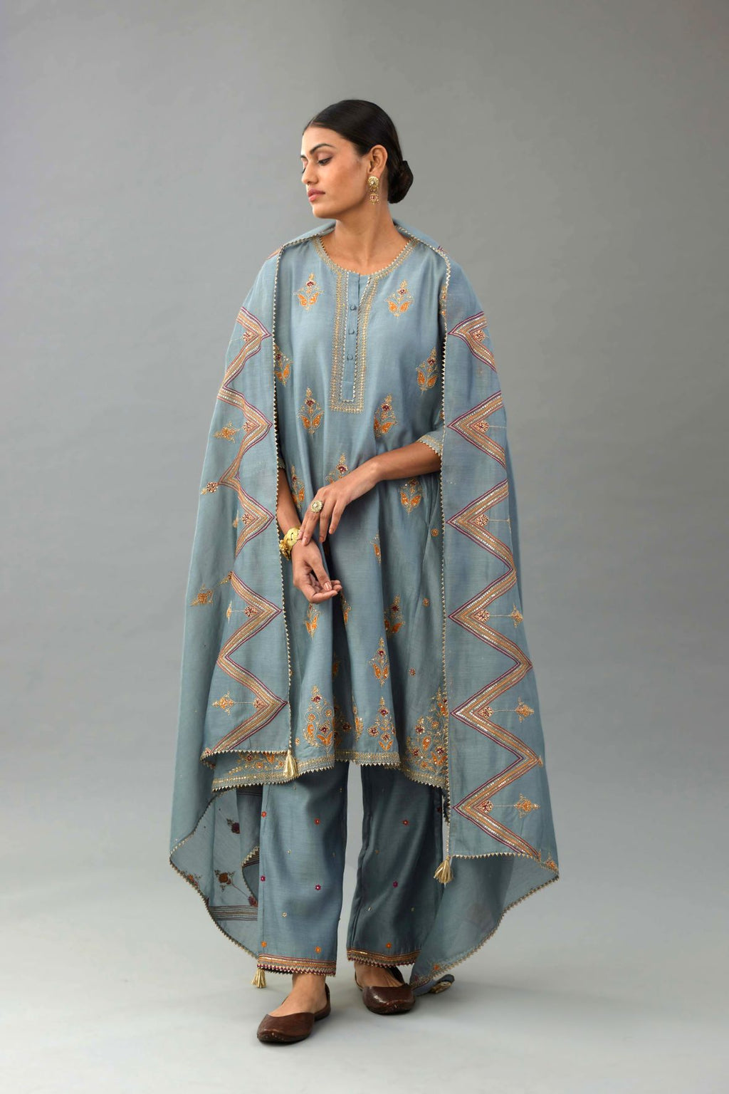 Light blue Silk chanderi dupatta in chevron pattern embroidery with contrast silk thread and dori at the sides.