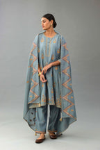 Light blue silk chanderi A-line short kurta set with dori and contrast silk thread embroidery, highlighted with gold sequins work.