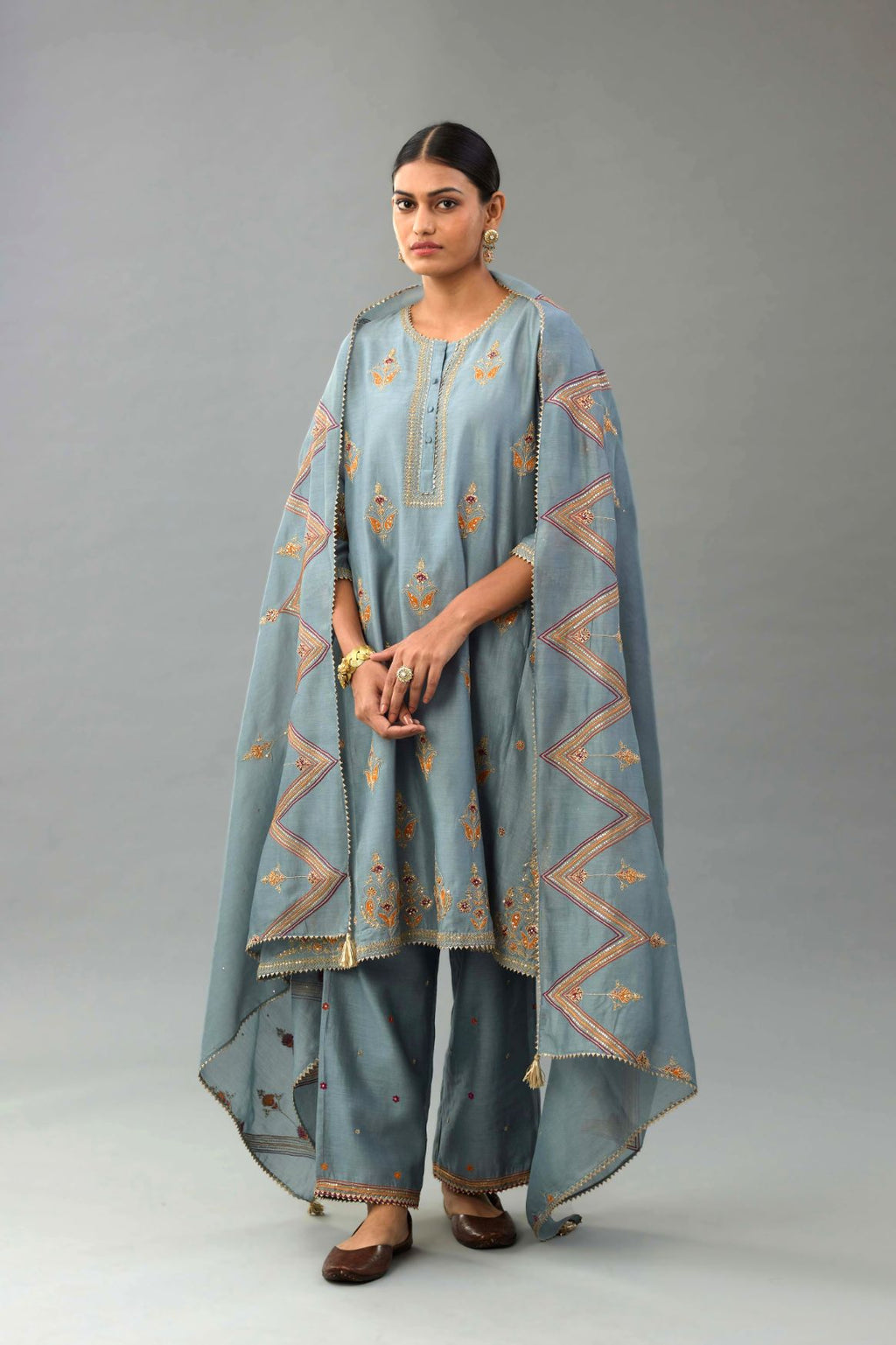 Light blue Silk chanderi dupatta in chevron pattern embroidery with contrast silk thread and dori at the sides.