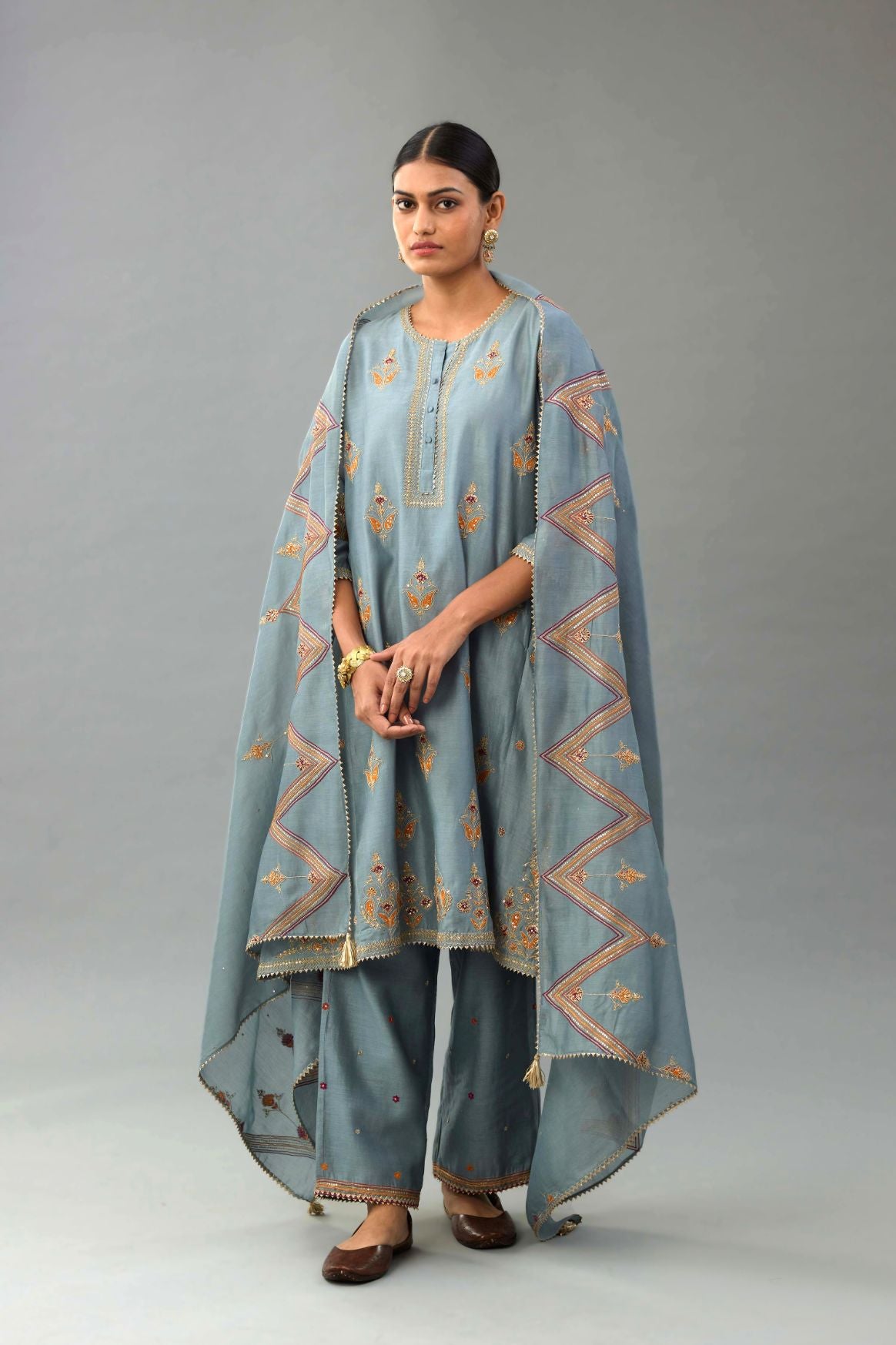Light blue Silk chanderi dupatta in chevron pattern embroidery with contrast silk thread and dori at the sides.