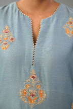 Light blue silk chanderi straight kurta set with zari, dori and contrast silk thread embroidered bootas, highlighted with gold sequins work.