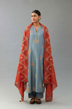 Light blue silk chanderi straight kurta set with zari, dori and contrast silk thread embroidered bootas, highlighted with gold sequins work.