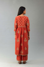 Rust silk chanderi kurta-dress set with all-over zari, dori and contrast silk thread embroidery, highlighted with gold sequins work.