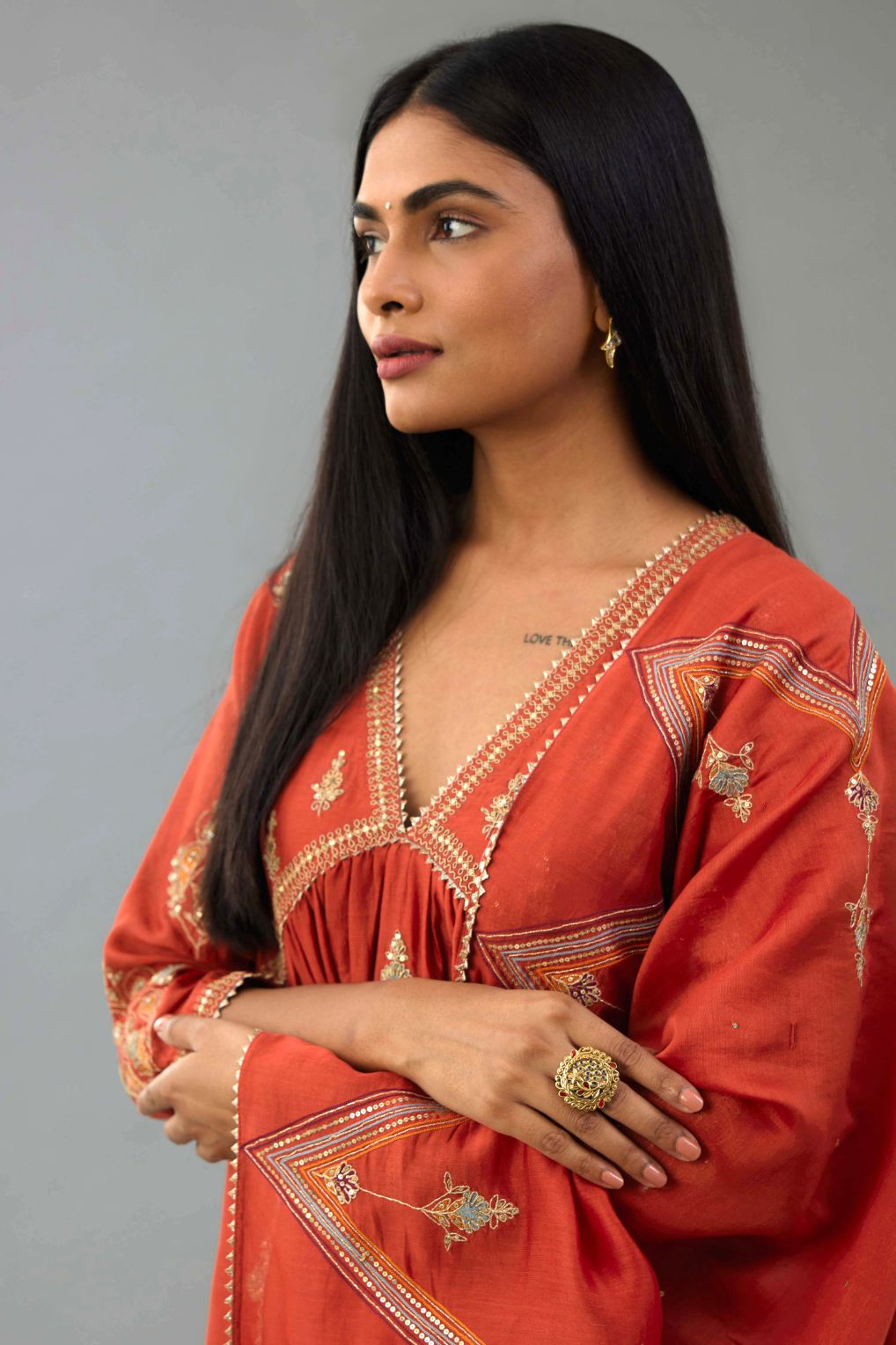Rust Silk chanderi dupatta in chevron pattern embroidery with contrast silk thread and dori at the sides.