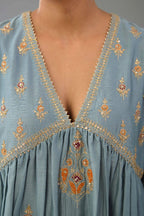 Light blue silk chanderi kurta-dress set with all-over zari, dori and contrast silk thread embroidery, highlighted with gold sequins work.