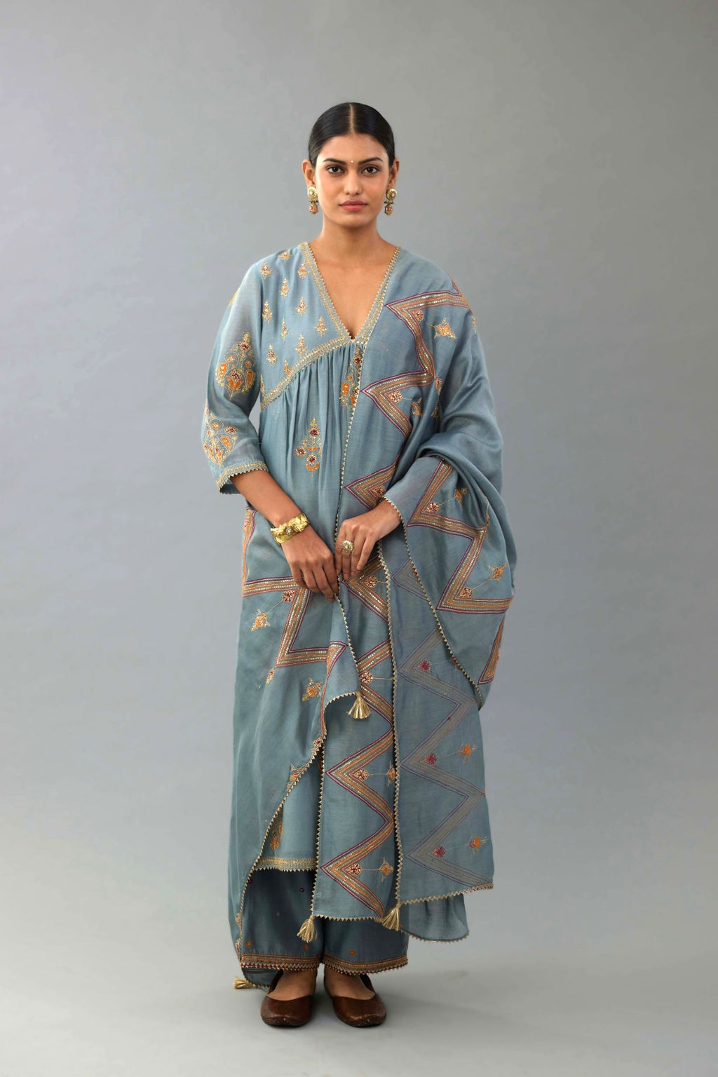 Light blue Silk chanderi dupatta in chevron pattern embroidery with contrast silk thread and dori at the sides.
