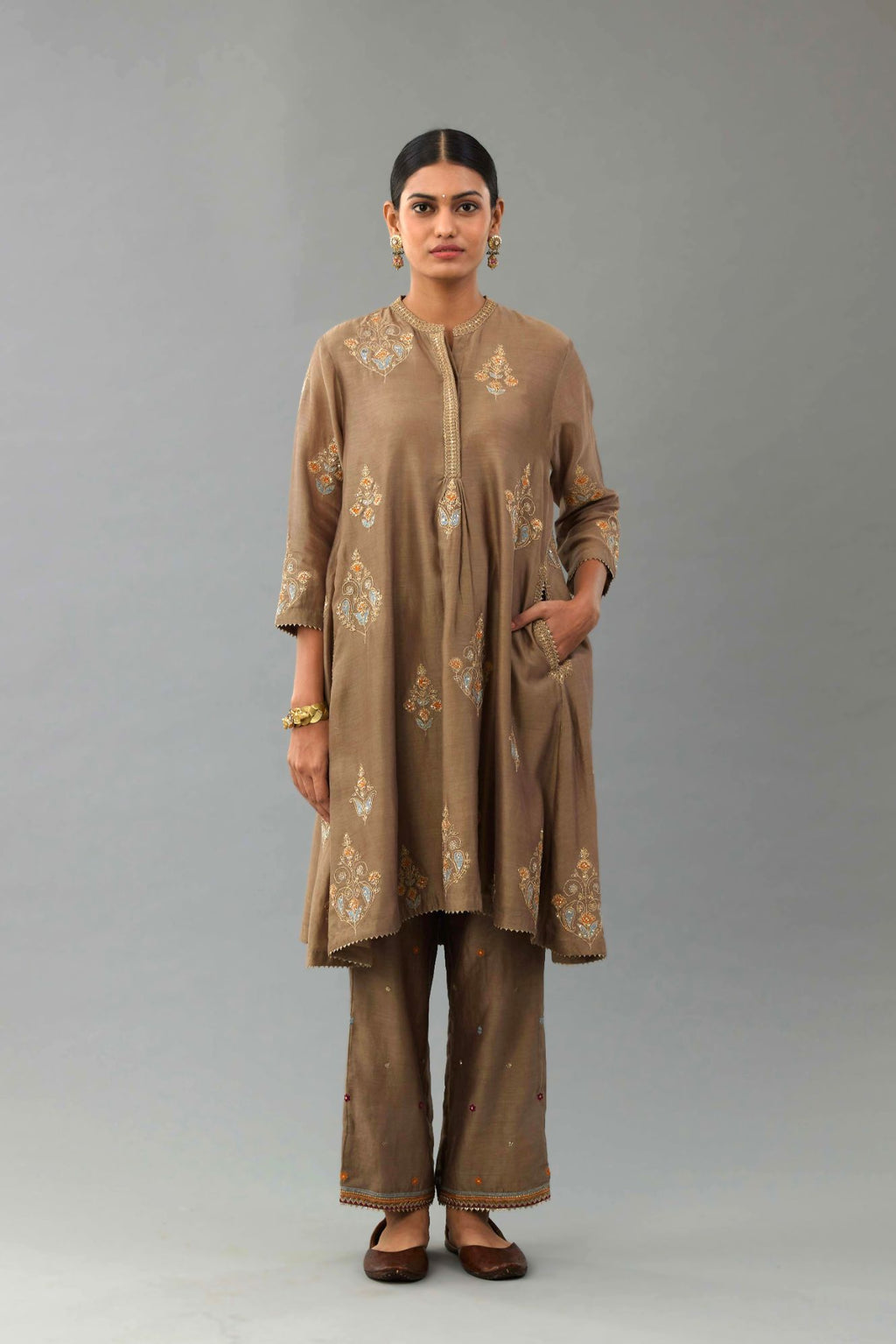 Taupe Silk Chanderi short kurta set with collar and front placket, detailed with delicate gold embroidery is done around the placket and collar.