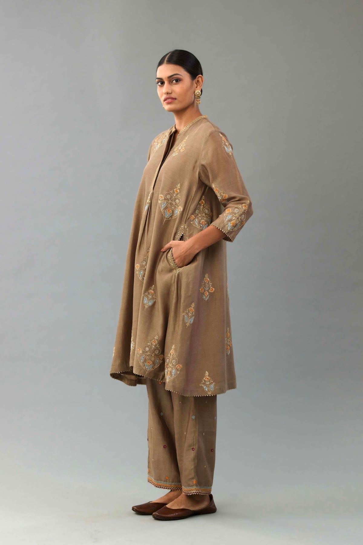 Taupe Silk Chanderi short kurta set with collar and front placket, detailed with delicate gold embroidery is done around the placket and collar.