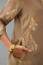 Taupe Silk Chanderi short kurta set with collar and front placket, detailed with delicate gold embroidery is done around the placket and collar.