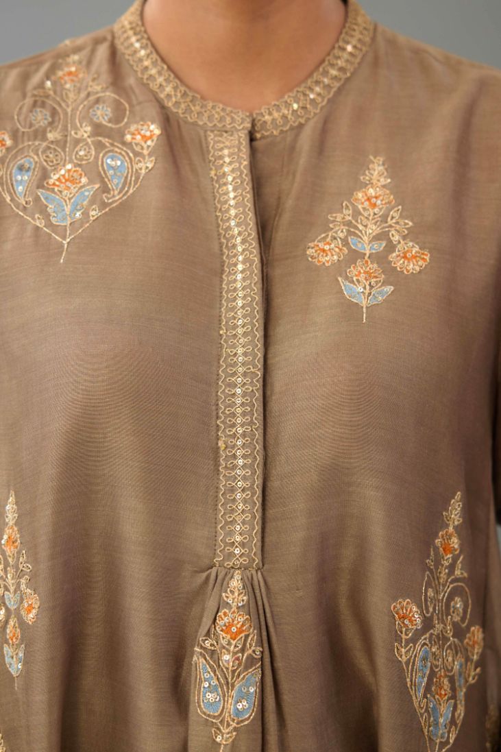 Taupe Silk Chanderi short kurta set with collar and front placket, detailed with delicate gold embroidery is done around the placket and collar.
