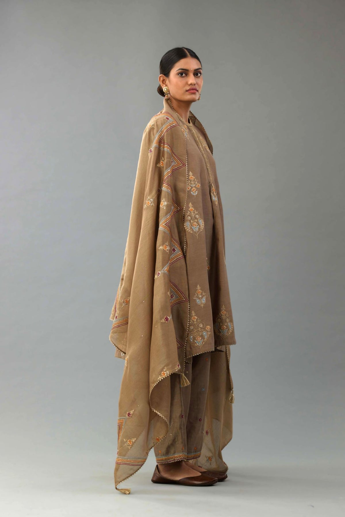 Taupe Silk Chanderi short kurta set with collar and front placket, detailed with delicate gold embroidery is done around the placket and collar.