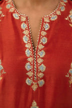 Rust silk chanderi straight kurta set with all-over zari, dori and contrast silk thread embroidery, highlighted with gold sequins work.