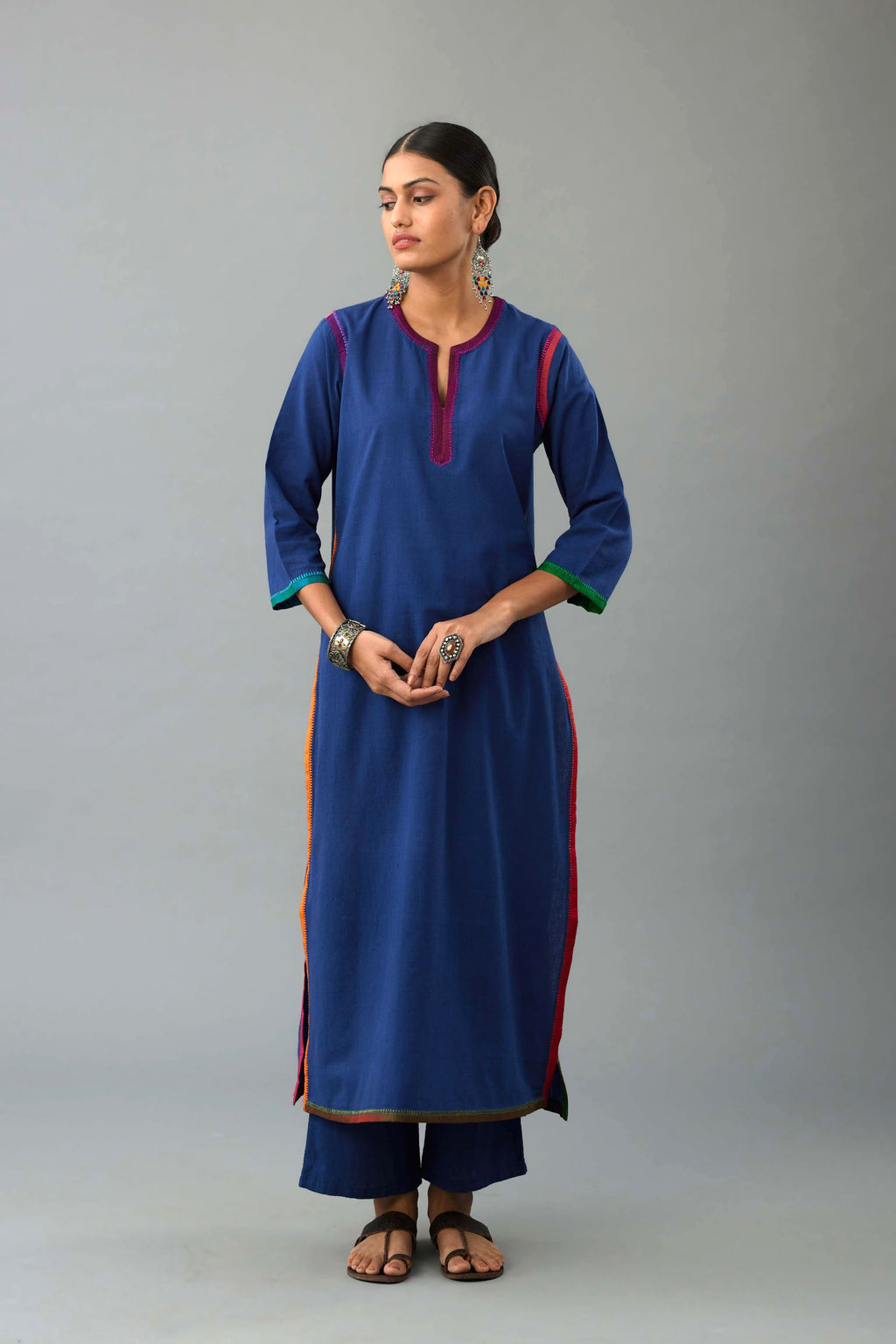 Blue handloom cotton straight kurta set with slit neck, multi colored silk facings and embroidery detail.