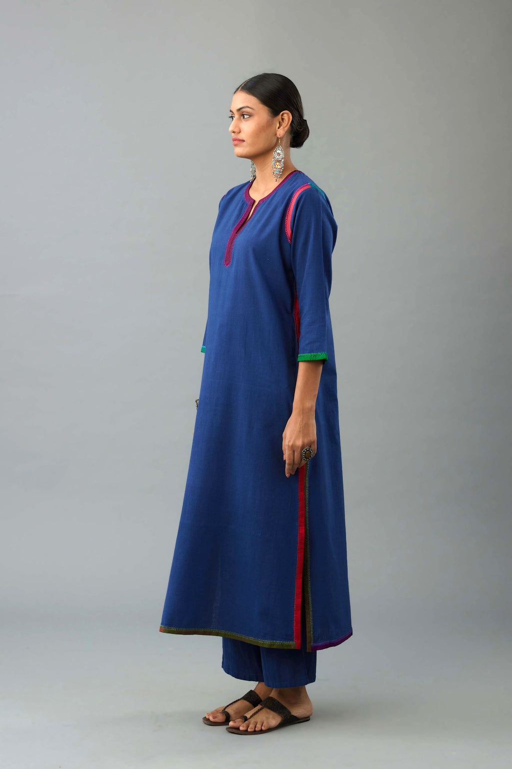 Blue handloom cotton straight kurta set with slit neck, multi colored silk facings and embroidery detail.