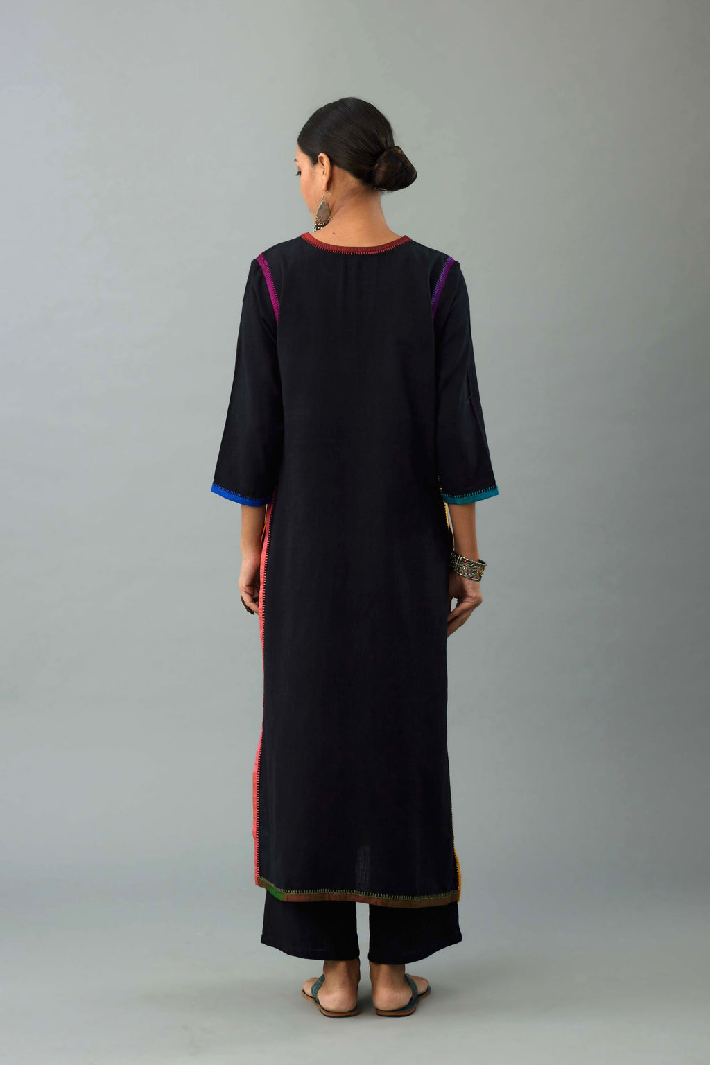 Black handloom cotton straight kurta set with multi colored silk facings and embroidery detail.