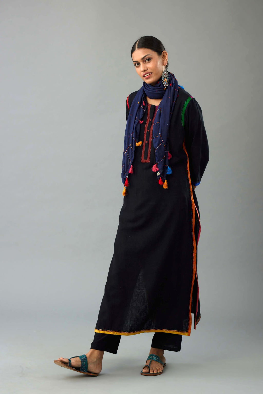 Black handloom cotton straight kurta set with multi colored silk facings and embroidery detail.