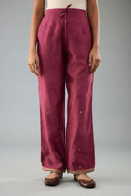 Wine silk chanderi straight pants with dori and contrast silk thread embroidery,  detailed with gold sequins work.