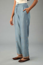 Light blue silk chanderi straight pants with dori and contrast silk thread embroidery,  detailed with gold sequins work.