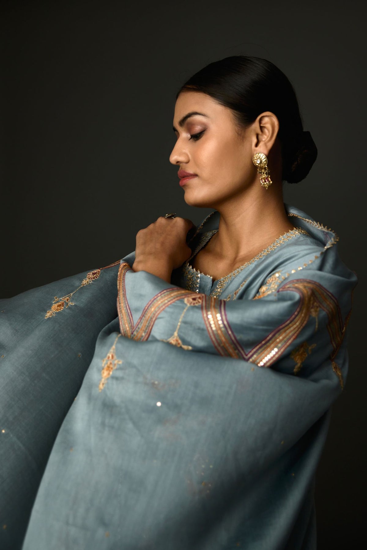 Light blue Silk chanderi dupatta in chevron pattern embroidery with contrast silk thread and dori at the sides.