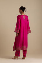 Fuchsia knee length A-line kurta set, highlighted with dull gold zari and sequins handwork.