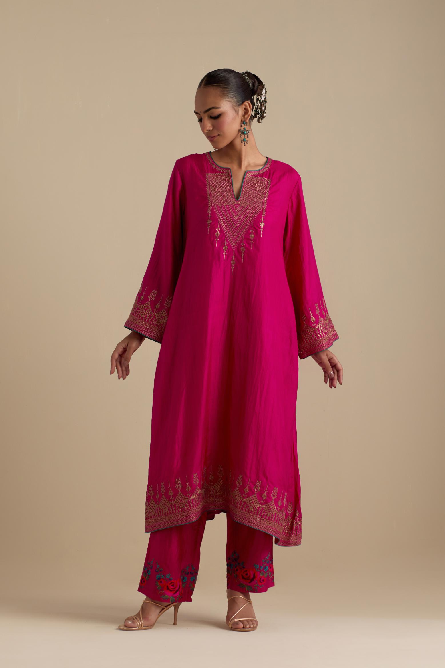 Fuchsia knee length A-line kurta set, highlighted with dull gold zari and sequins handwork.
