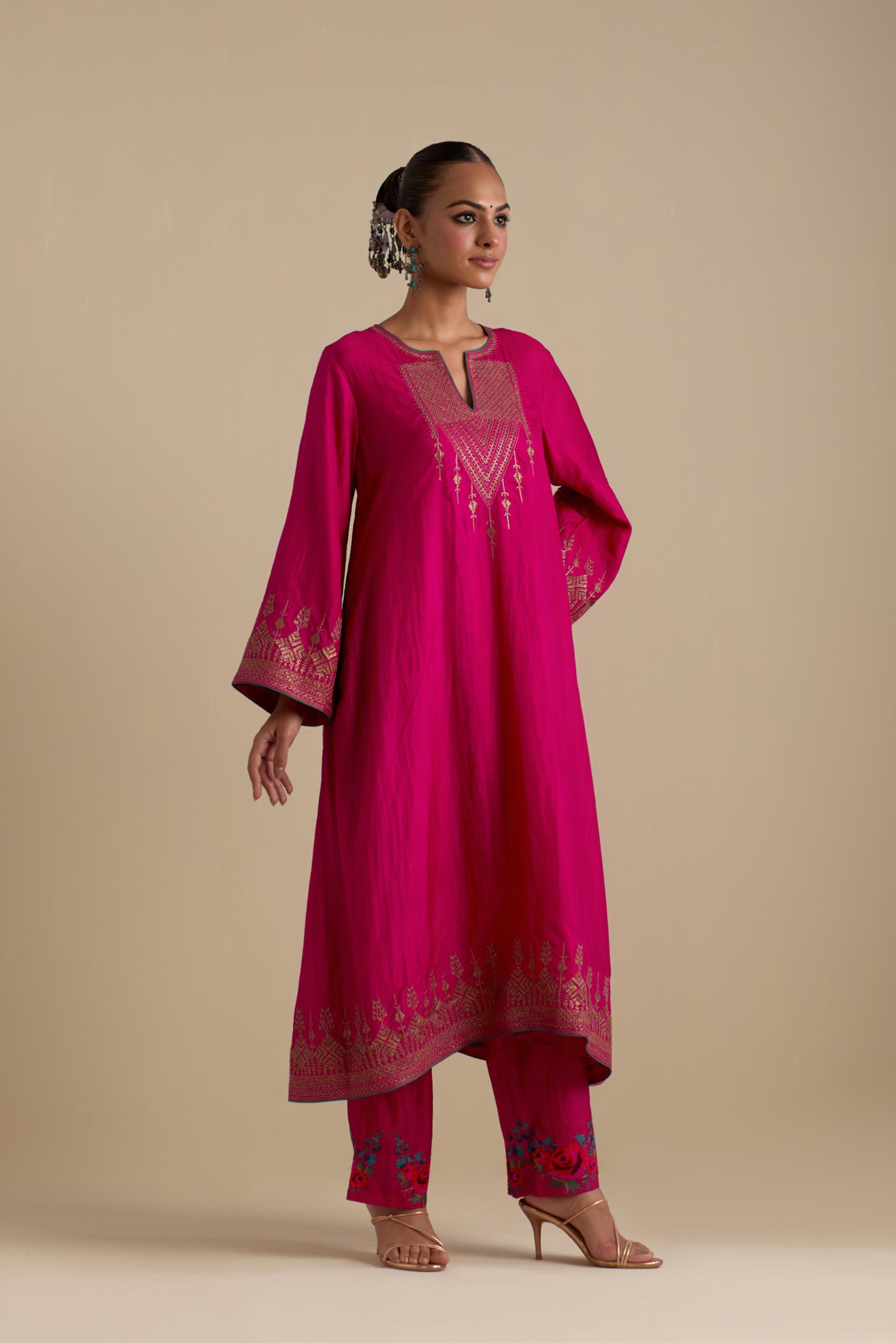 Fuchsia knee length A-line kurta set, highlighted with dull gold zari and sequins handwork.