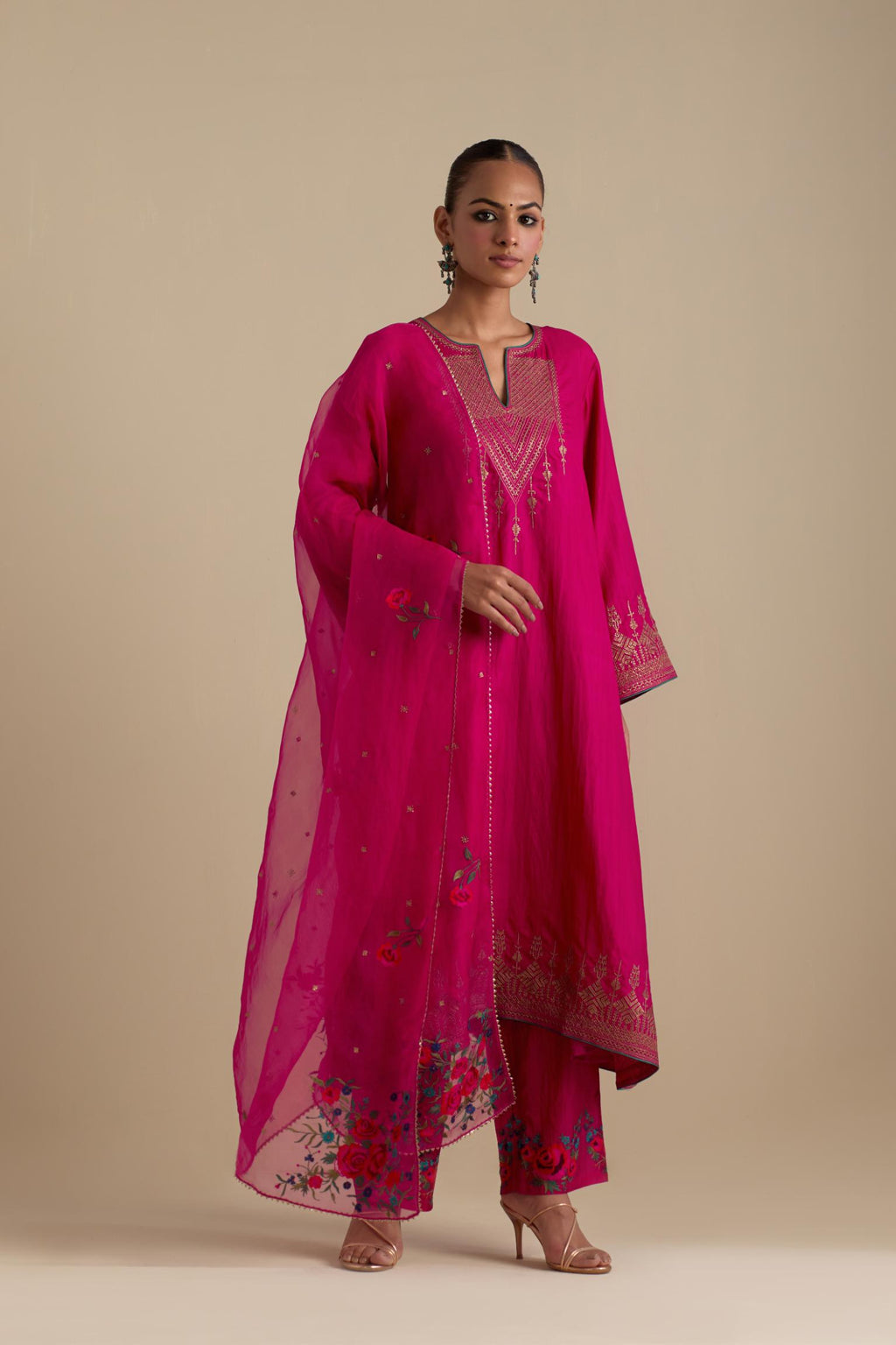 Fuchsia silk organza dupatta, highlighted with delicate dull gold sequins work and all-over thread embroidery roses, with a large bunch at the dupatta corners.