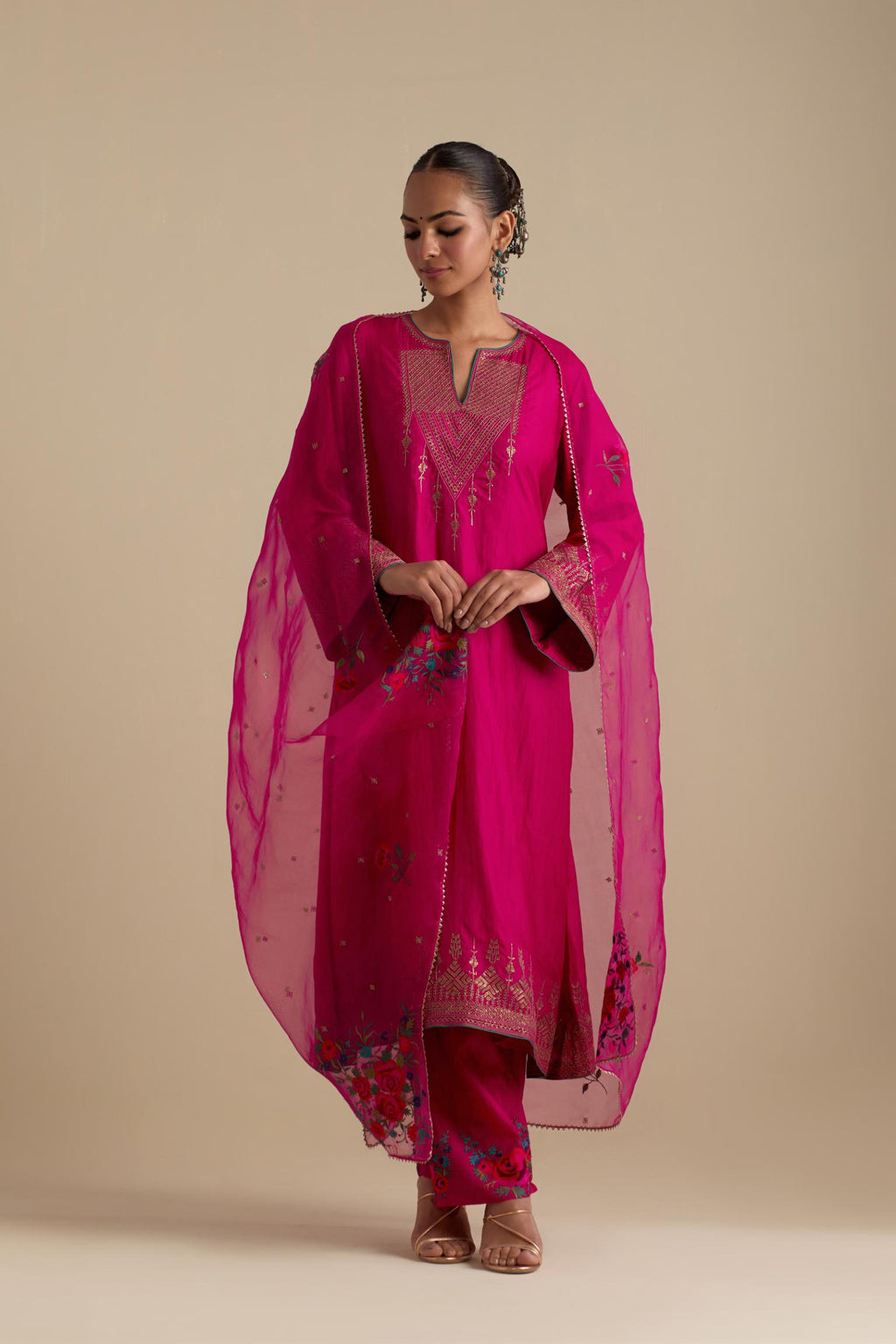 Fuchsia silk organza dupatta, highlighted with delicate dull gold sequins work and all-over thread embroidery roses, with a large bunch at the dupatta corners.