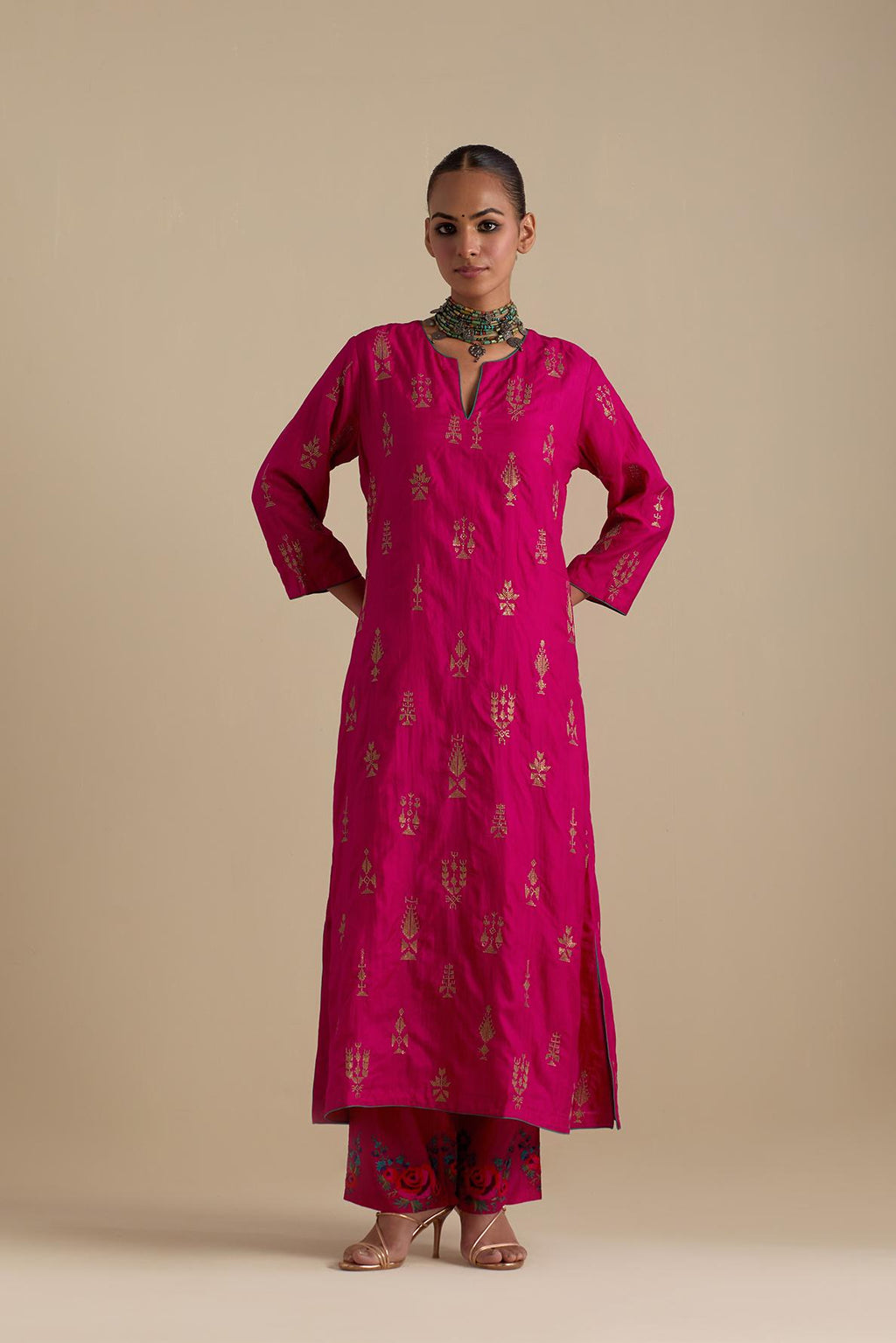 Fuchsia silk straight long kurta set, highlighted with dull gold zari and sequins handwork.