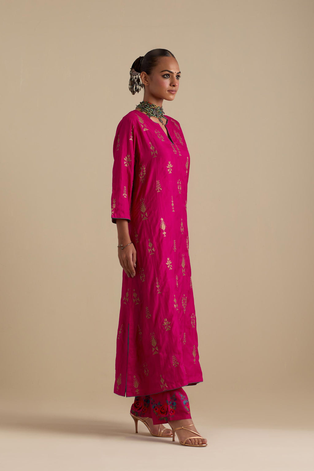 Fuchsia silk straight long kurta set, highlighted with dull gold zari and sequins handwork.