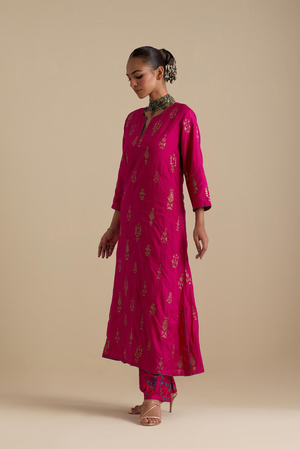 Fuchsia silk straight long kurta set, highlighted with dull gold zari and sequins handwork.