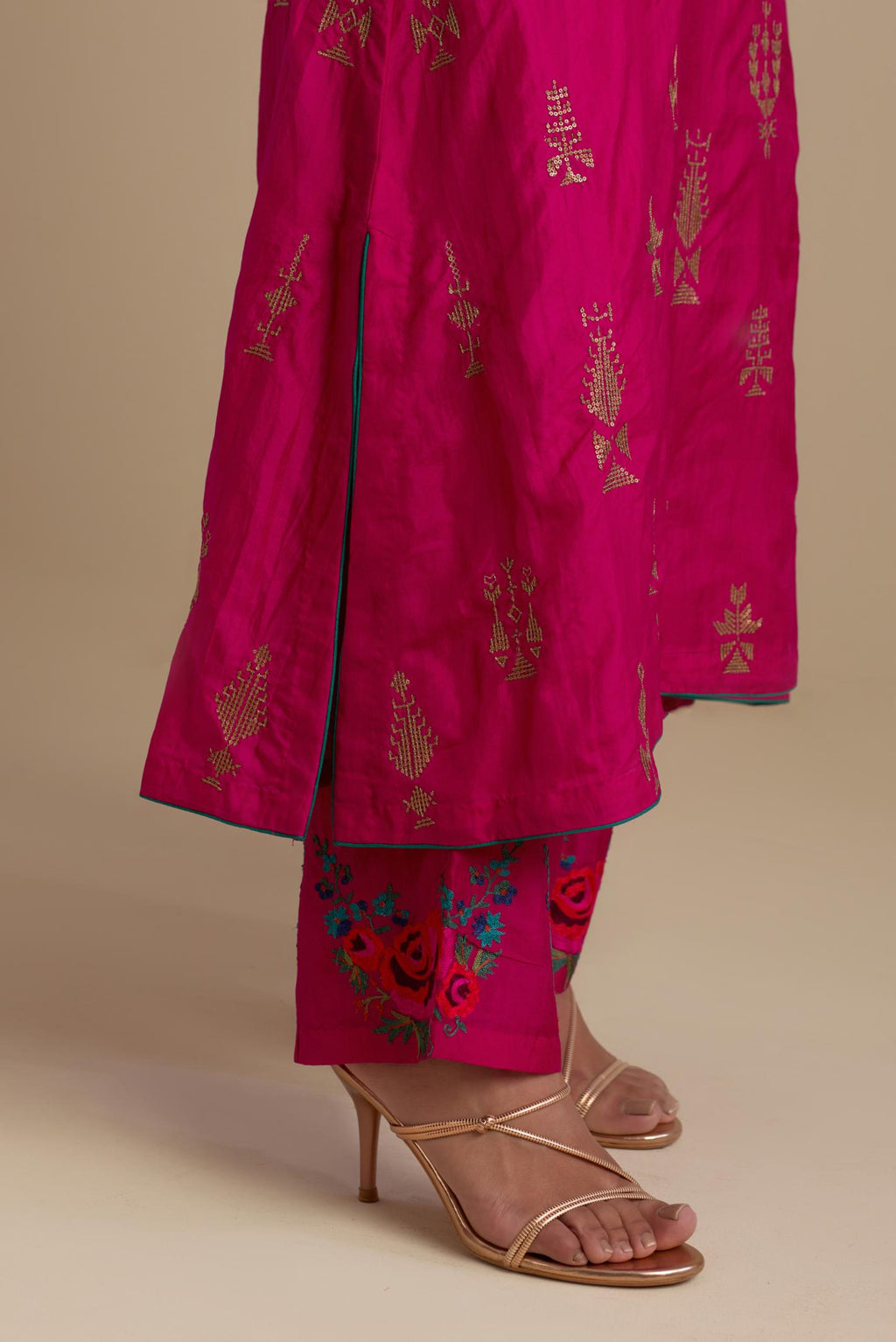 Fuchsia silk straight long kurta set, highlighted with dull gold zari and sequins handwork.