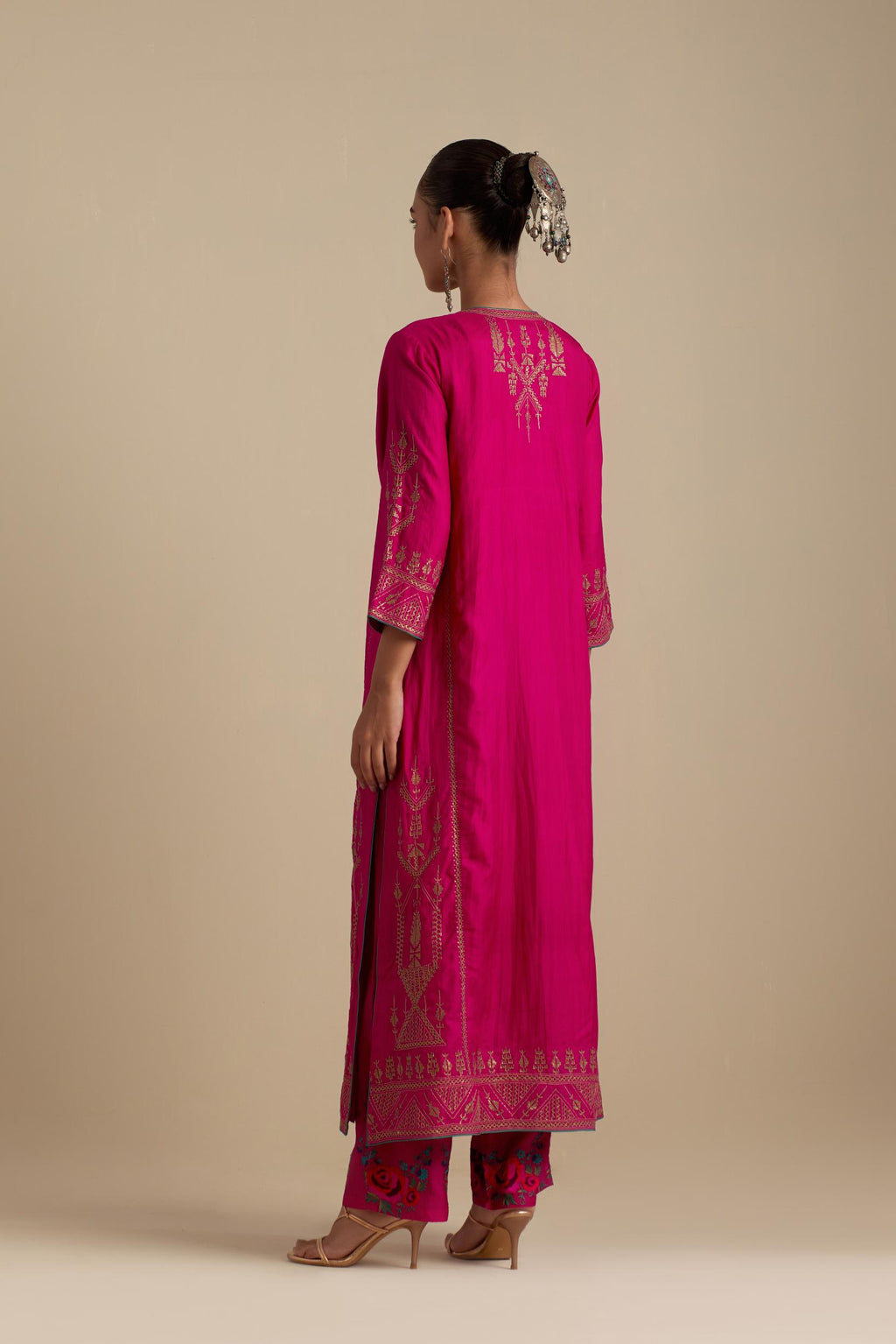 Fuchsia silk straight long kurta set with side panels, highlighted with dull gold zari and sequins handwork.