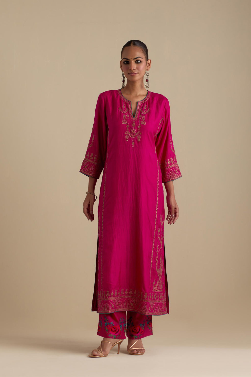 Fuchsia silk straight long kurta set with side panels, highlighted with dull gold zari and sequins handwork.