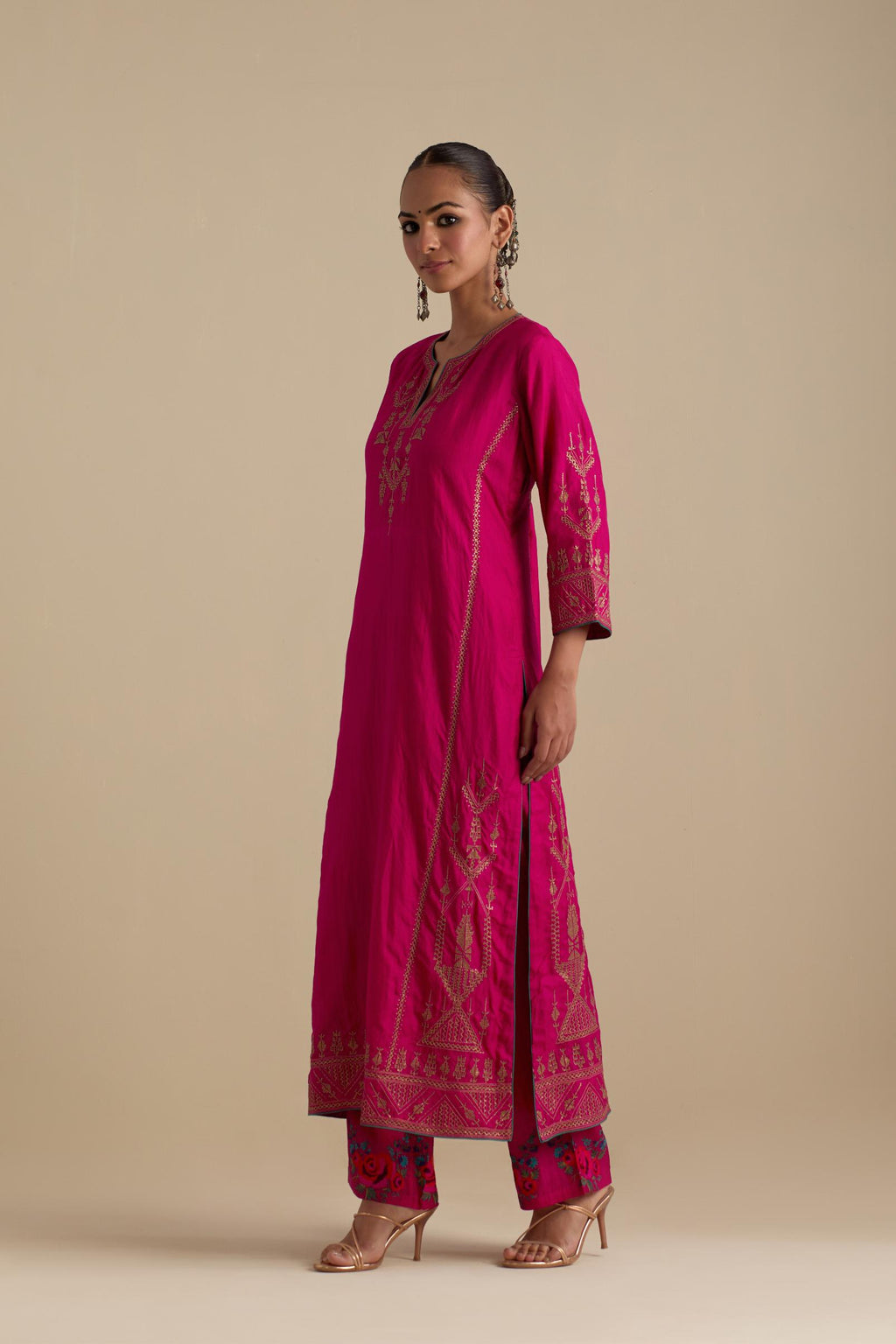 Fuchsia silk straight long kurta set with side panels, highlighted with dull gold zari and sequins handwork.