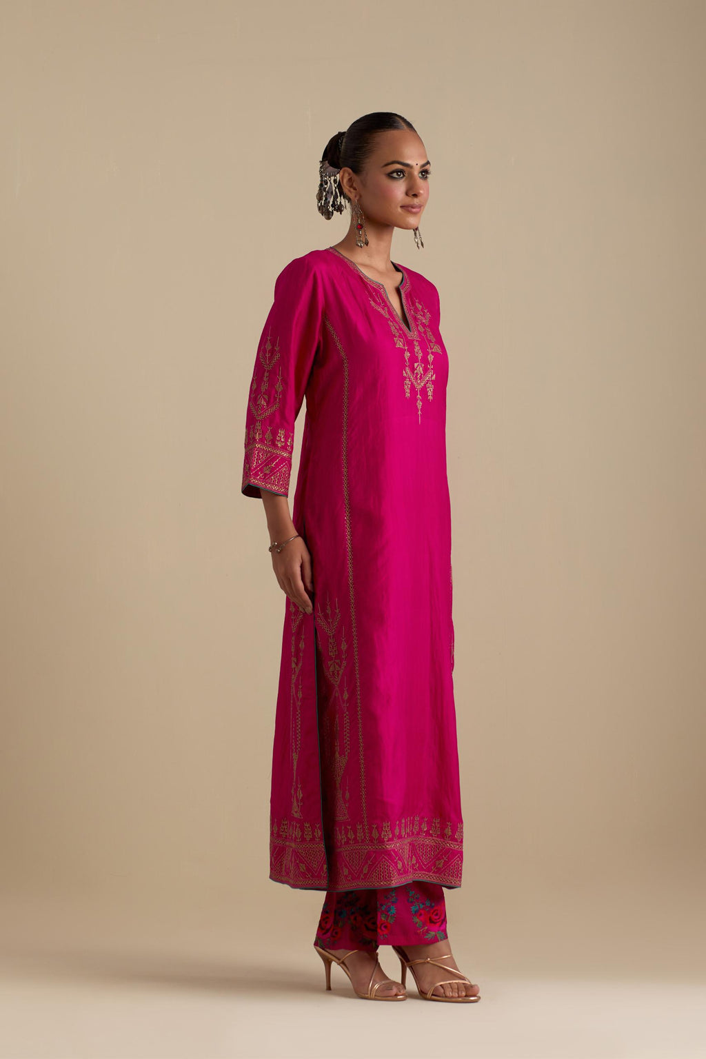 Fuchsia silk straight long kurta set with side panels, highlighted with dull gold zari and sequins handwork.